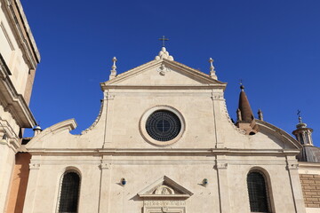 Santa Maria del Popolo Church Facade Detail with Bright Blue Sky at Piazza del Popolo in Rome, Italy