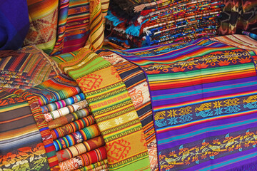 traditional colorful fabric in a market in Peru
