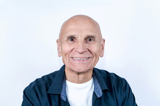Closeup photo portrait of elder person with candid smile on his face