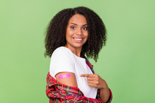 Profile side photo of young african woman indciate finger corona virus prevention adspromo isolated over green color background