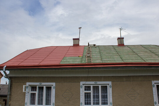 roof painting,old house painted roof in red
