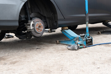 Photograph of a brake disc at a service station. Repair balancing and tire fitting of wheels.