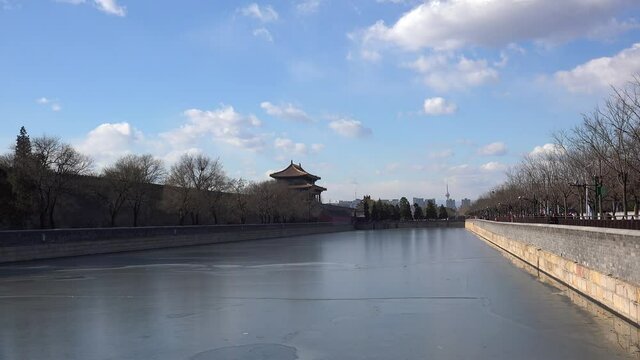 Icy Tongzi River around Forbidden City from the Gate of Divine Migh. Beijing, China