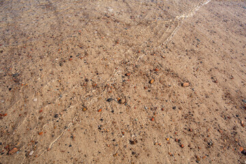Sand and different stone pebbles as background. 