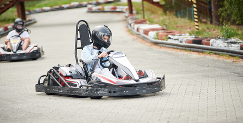 Karting. motorsport road racing with open-wheel four wheeled vehicles at go-karts - obrazy, fototapety, plakaty