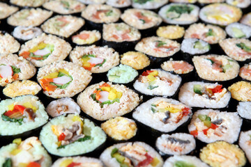 Sushi Set - Different Types of Maki Sushi and Nigiri Sushi. Served on dark wooden table.