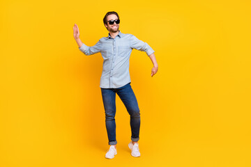Fototapeta na wymiar Full body photo of young handsome man happy positive smile funny dance hipster clubber isolated over yellow color background