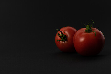 Tomatoes on a black background