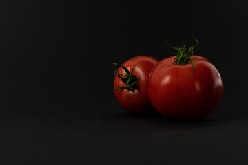 Tomatoes on a black background