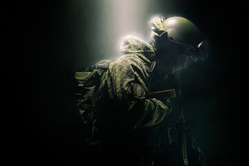 A member of a special purpose unit. Russian special forces soldiers with submachine gun in clouds...