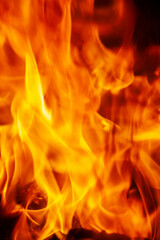 Close up fire flamme background as symbol of hell and eternal pain. Vertical image.