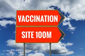 a traffic sign indicating the place of vaccination