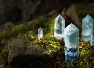 Different crystals on moss in forest, space for text