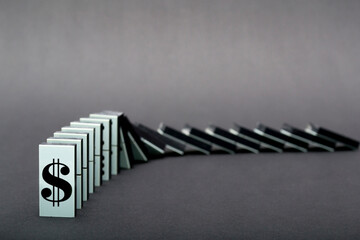 Dominoes falling in a row , gray background