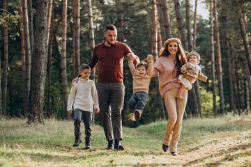 Fototapeta premium Young family with children in park