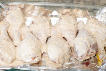 Marinated Raw Chicken Drumsticks on a pan