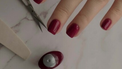 Professional trendy Hardware Manicure. Procedure for the preparation of nails. Cuticle Pusher Remover. Nail file scissors Top view. Do manicure by yourself staying at home. Self care. Red autumn fall 