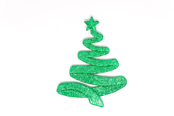 Green toy Christmas tree on a white background