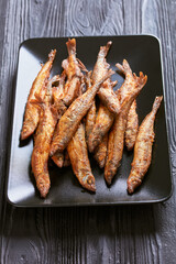 crispy fried capelin, shishamo on a platter