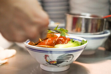 Asian dish of soy sauce chicken rice