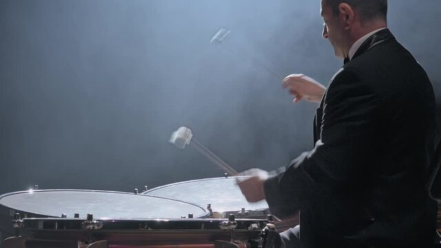 Musician playing the timpani