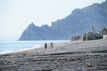 horseback riding on the beach near Taormina in Sicily