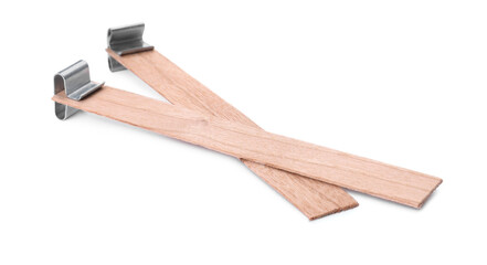 Wooden wicks with stabilizers on white background. Homemade candle material