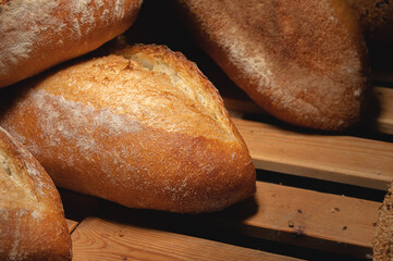 Craft loaves of bread. Fresh hot bread from the oven. Appetizing and healthy food