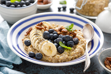 Oatmeal with fresh blueberries and pecans and banana