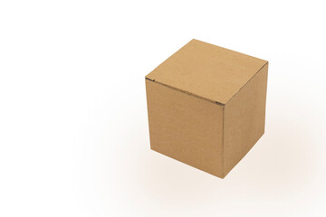 A small cardboard box made of corrugated cardboard on a white background with a light shadow