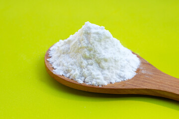 Baking soda on green background.