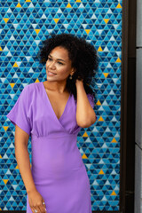 beautiful girl in a dress on a colored background