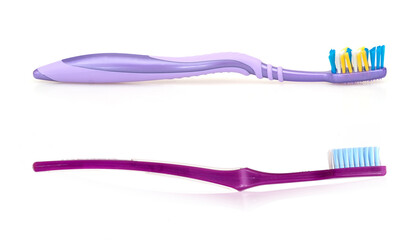Violet toothbrushes isolated on a white background