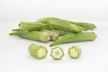 Small pile of green okra on a white background