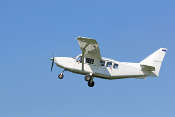 Ultralight airplane flying in a blue sky