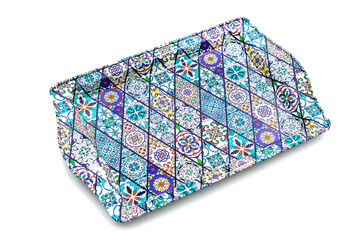 Metal tray with traditional Turkish ornament on a white background.