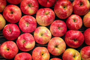 Top table view on harvested red apples. Ripe apples on wooden table