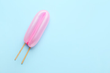 Beautiful balloon with sticks on blue background