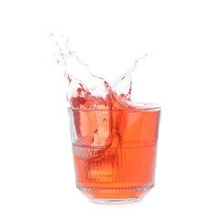 Glass of classic negroni cocktail with splashes on white background