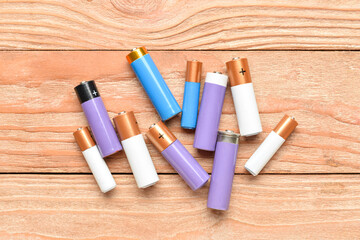Alkaline batteries on wooden background