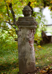 fretwork on column in red bricks Garden with tall poplar trees terracotta brick pillar