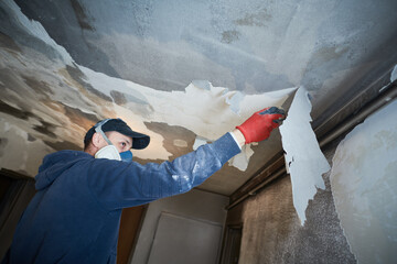 fire damage and restoration indoor interior. removing damaged paint layer - 469573036