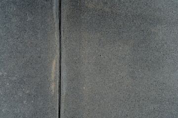 Fototapeta premium Sidewalk and street concrete asphalt texture with stains and wear
