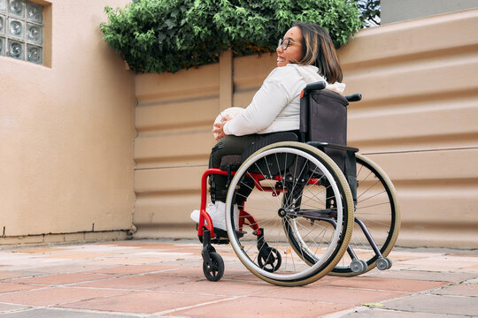 young woman in wheelchair at home