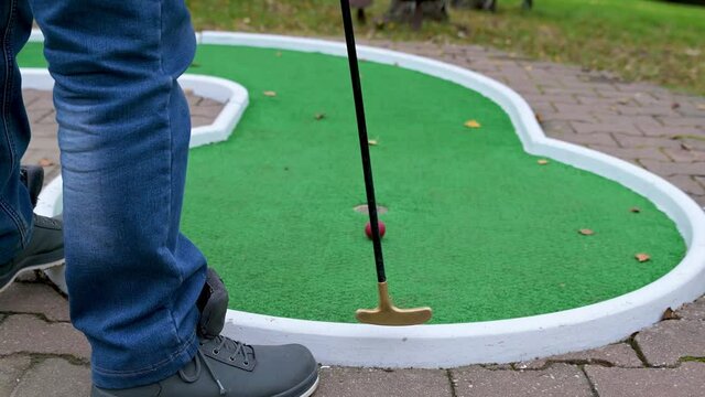 playing mini golf in autumn in germany