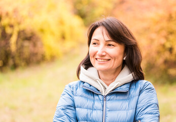 Portrait of a beautiful confident woman on a walk in the park