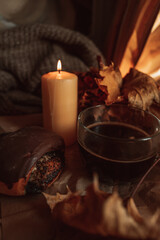 A cup of black morning coffee with a sweet bun with poppy seeds. Delicious meal. Aesthetics in details. Beige and brown cozy shades