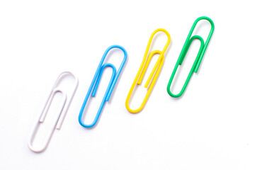 Colorful plastic paper clipson on a white background