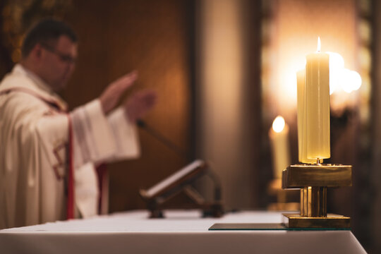 Priests during a mass/wedding ceremony/nuptial mass (shallow DOF; color toned image)