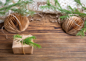 Packed Christmas gift box with natural Christmas decor, balloons and a Christmas tree. Zero waste.